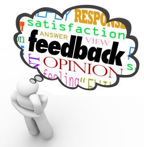 A person thinks with a thought cloud over his head containing the words feedback, opinion, satisfaction, answer, view, response, reply, review and more