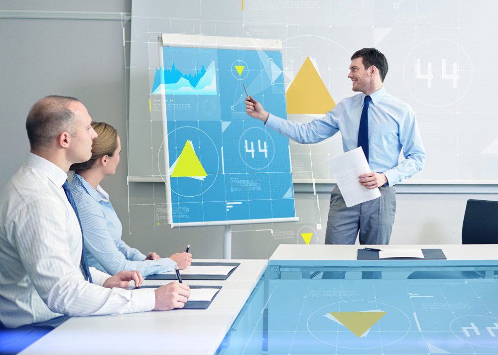 Man presenting sales numbers from business intelligence in a meeting