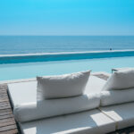 luxury swimming pool on sea view and beach chair in hotel resort