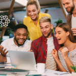 A diverse team cheering at a computer celebrating success because they used AI to improve marketing campaign ROI. It looks like the actor Will Smith is there too.