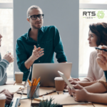 A business team gathered around a table discussing their ai strategy framework.