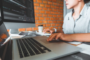 A woman on computer working diligently wanting to get started on ai