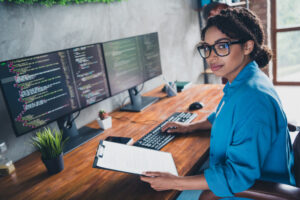 Woman on computer excited to get started with ai