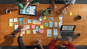 a top view of a group brainstorming at one of the leading ai consulting firms