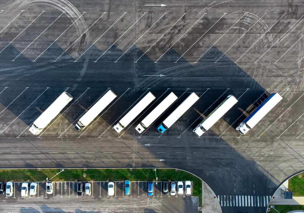 Aerial view of trucks parked in the parking lot. Directly above. Top down view