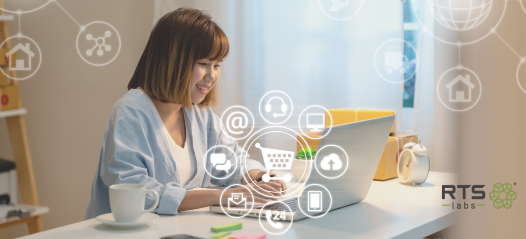 An Asian woman on a computer enjoying an AI-enhanced customer experience