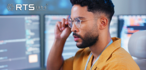 Man with glasses keeping a close eye on an ai project as part of the ai regulatory landscape