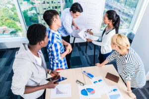 A group of tech people at work after building an ai-focused team.