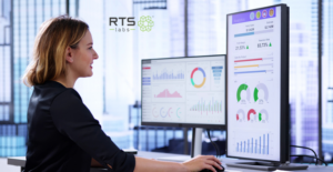 A woman measuring the roi from generative ai on her computer in a high rise office.