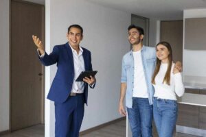 real estate agent showing property to potential investors