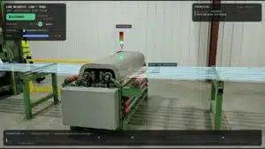 Line monitor overlay on a strapping machine showing a green stack light and the strap line being monitored