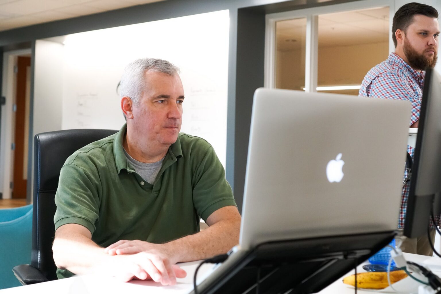 RTS Labs engineers working at their laptops in the office